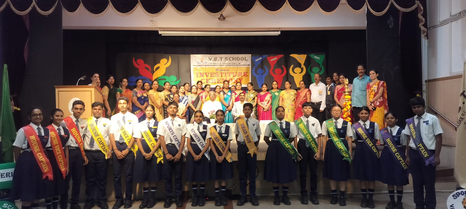 Student leaders and staff assembled on stage for the VET School investiture ceremony